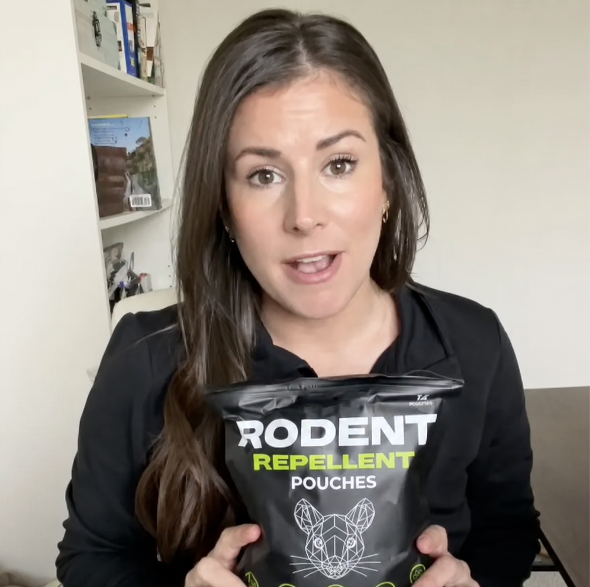 Customer review holding Lovevel Rodent Repellent Pouches