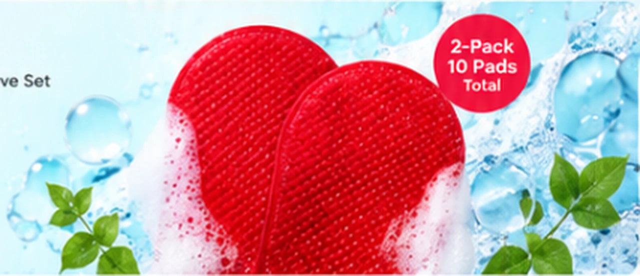 Two red exfoliating body gloves with water and leaves