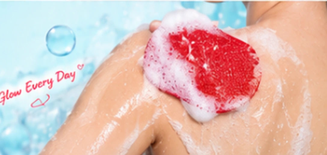Red exfoliating glove used on wet skin